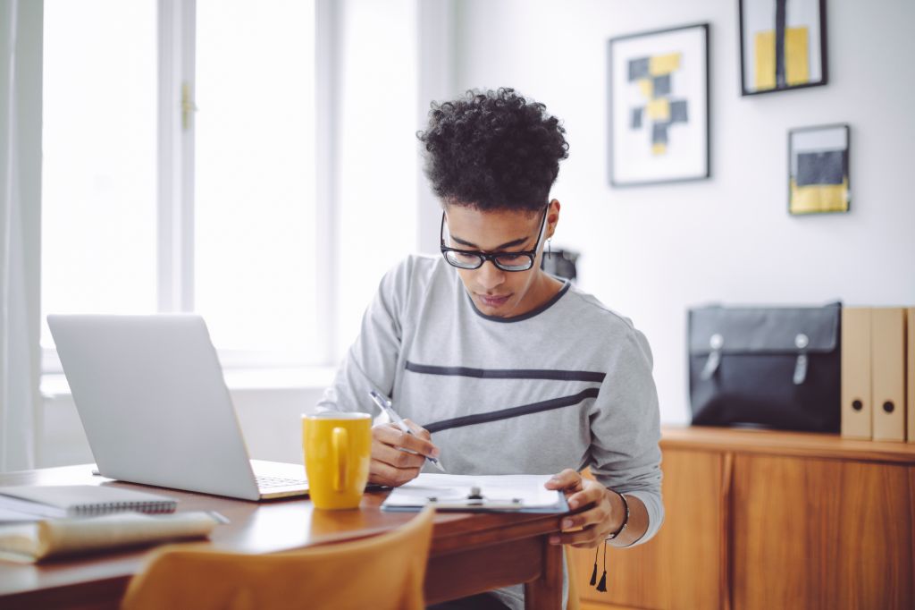 Young man working at home office