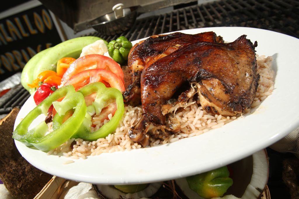 March 21 2010. Jerk chicken on the grill at Uptown a Jamaican grill located at a gas station and car