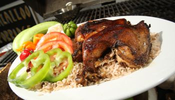 March 21 2010. Jerk chicken on the grill at Uptown a Jamaican grill located at a gas station and car