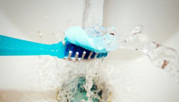 Close-Up Of Toothbrush Under Water