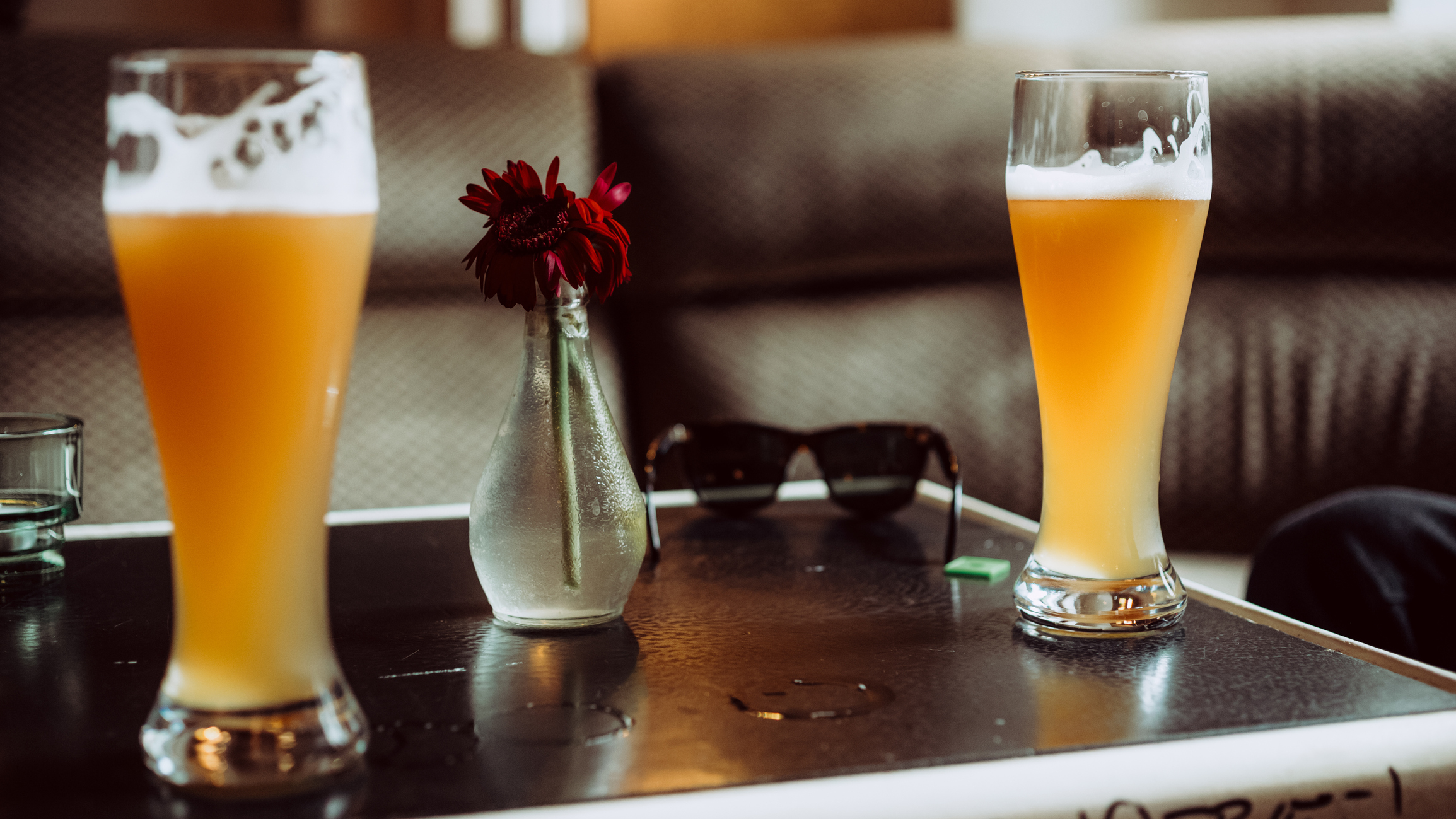 Close-Up Of Beer Glasses On Table At Restaurant