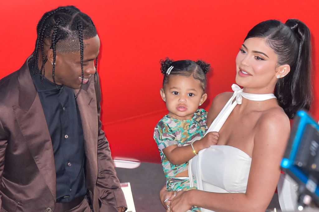 Rapper Travis Scott, Stormi Webster and television personality Kylie Jenner arrive at the Los Angeles Premiere Of Netflix's 'Travis Scott: Look Mom I Can Fly' held at Barker Hangar on August 27, 2019 in Santa Monica, Los Angeles, California, United States