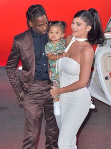 Rapper Travis Scott, Stormi Webster and television personality Kylie Jenner arrive at the Los Angeles Premiere Of Netflix's 'Travis Scott: Look Mom I Can Fly' held at Barker Hangar on August 27, 2019 in Santa Monica, Los Angeles, California,