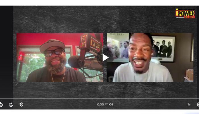 Two men, one with a beard and glasses, the other smiling, in a video call or interview setting with a "Power" logo visible.