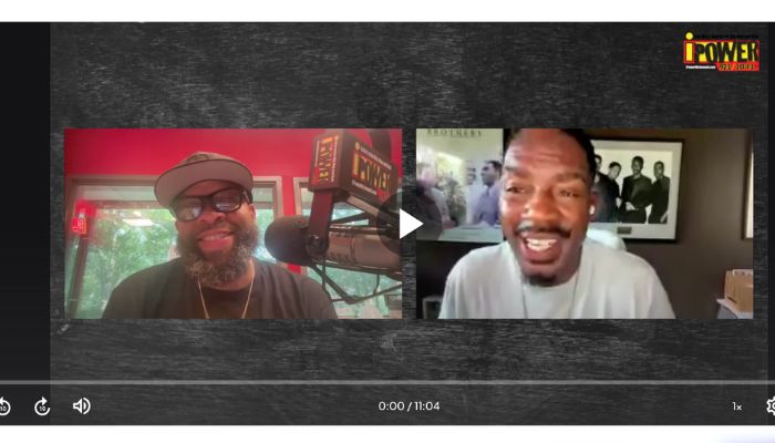 Two men, one with a beard and glasses, the other smiling, in a video call or interview setting with a "Power" logo visible.